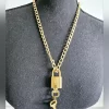 Louis Vuitton Gold Lock, 2 Keys & Chain - Image 3