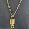 Louis Vuitton Gold Lock, 2 Keys & Chain - Image 4